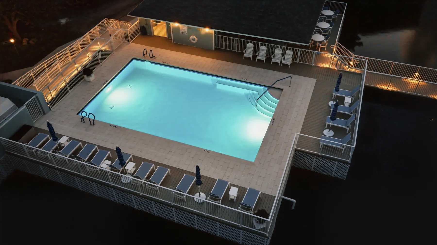 Completed Hutchinson House waterfront pool and deck at night