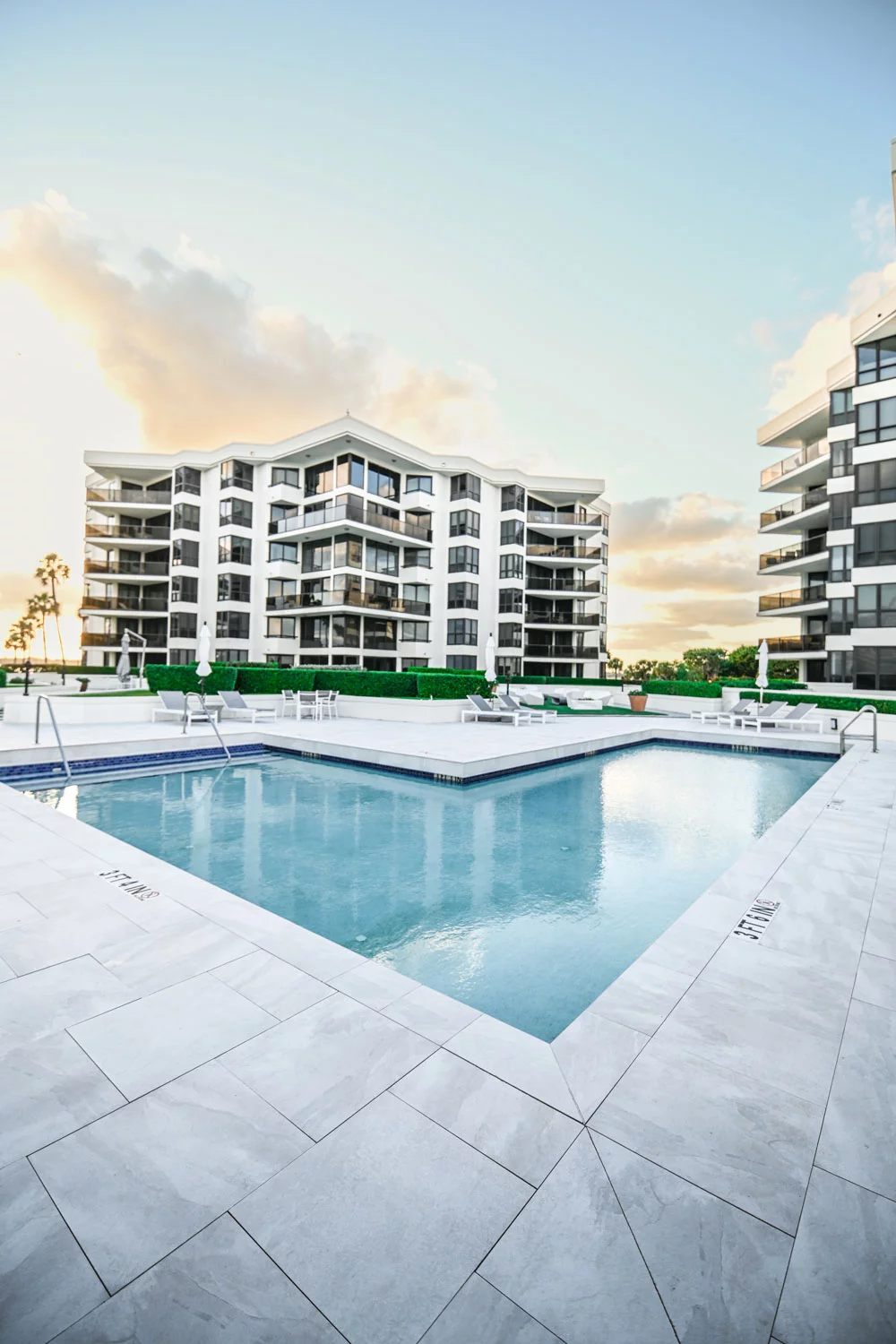 Oasis Palm Beach condominium pool and deck area