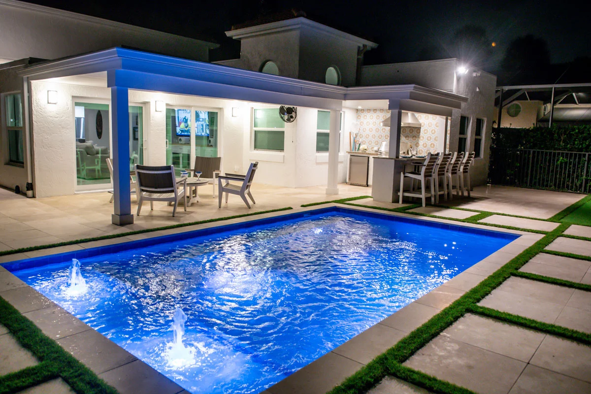 The Narrows residential pool with evening lighting